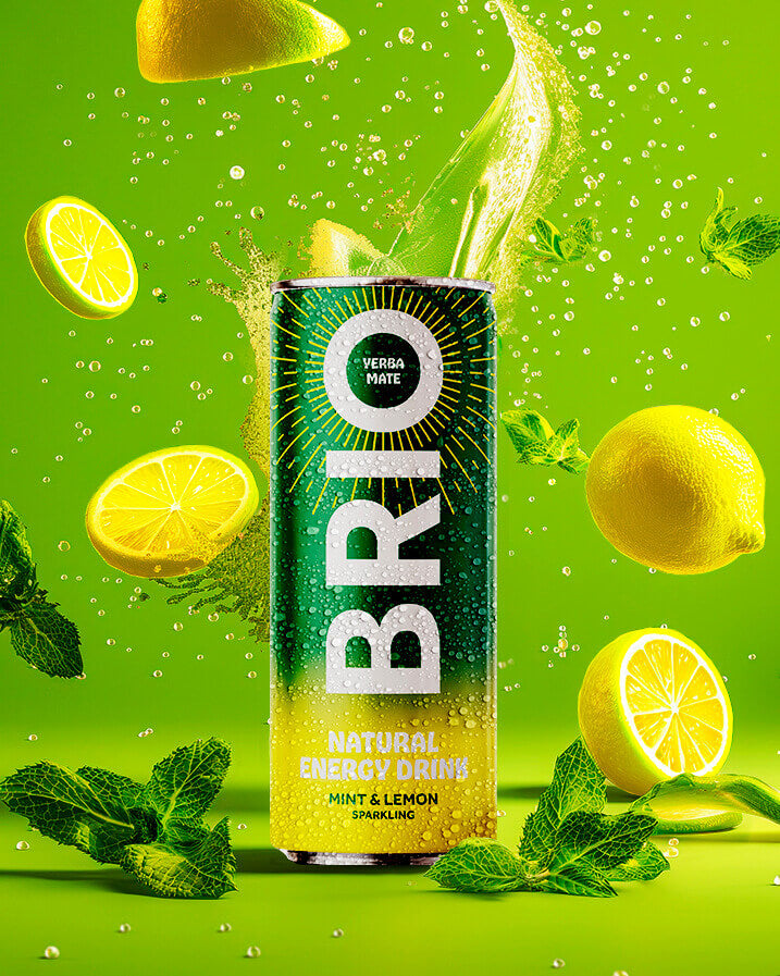 A product shot of a BRIO energy drink can with mint and lemon flavor, surrounded by fresh mint leaves and lemon slices, with a splash of liquid and falling lemon slices